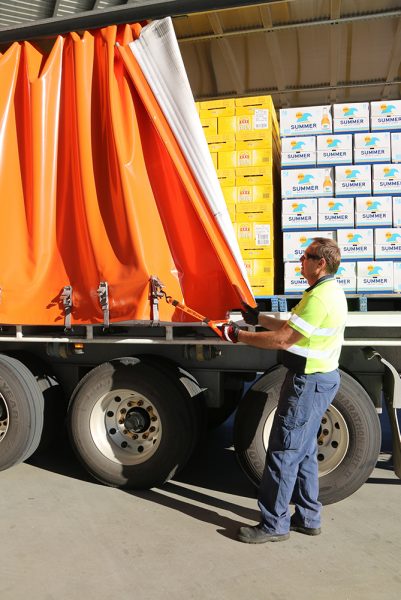 Matthew Muller from BevChain using a Strong Arm Strap to close a tautliner curtain.