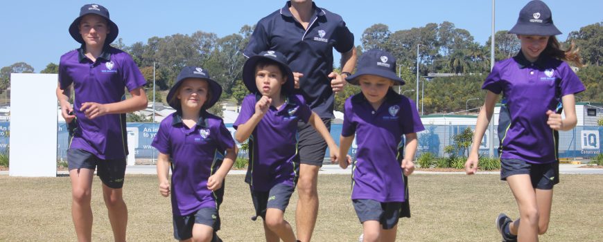 Bli Bli Unite Fun Run Walk preparations - Markos Hondroudakis (yr 7) , Asta Kitson (yr 1), Huxley Holahan (yr 1), Madalyn McKennariey (yr 1), Meleah McKay (yr 7) with teacher Matthew Rattney