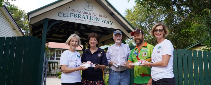 Buderim-Foundations-Roz-Bull-left-and-Keryn-Buderim-Rotarys-Lyn-Phillips-Buderim-Lions-Brian-McBride-presented-back-to-school-vouchers-to-Buderim-Mountain-State-Schools-Chappy-Dave-for-distribution